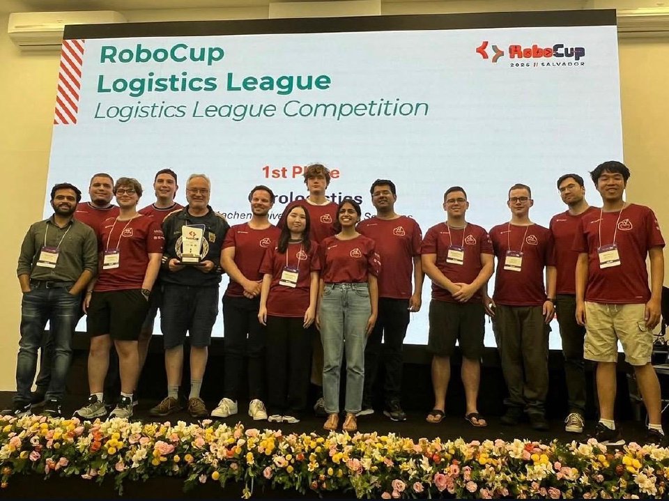 The Carologistics team on stage after winning the RoboCup 2025 Logistics League in Salvador, Brazil.